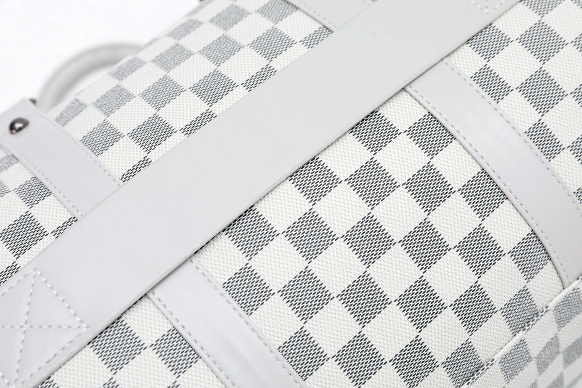 Silver duffel bag strap and checkered fabric